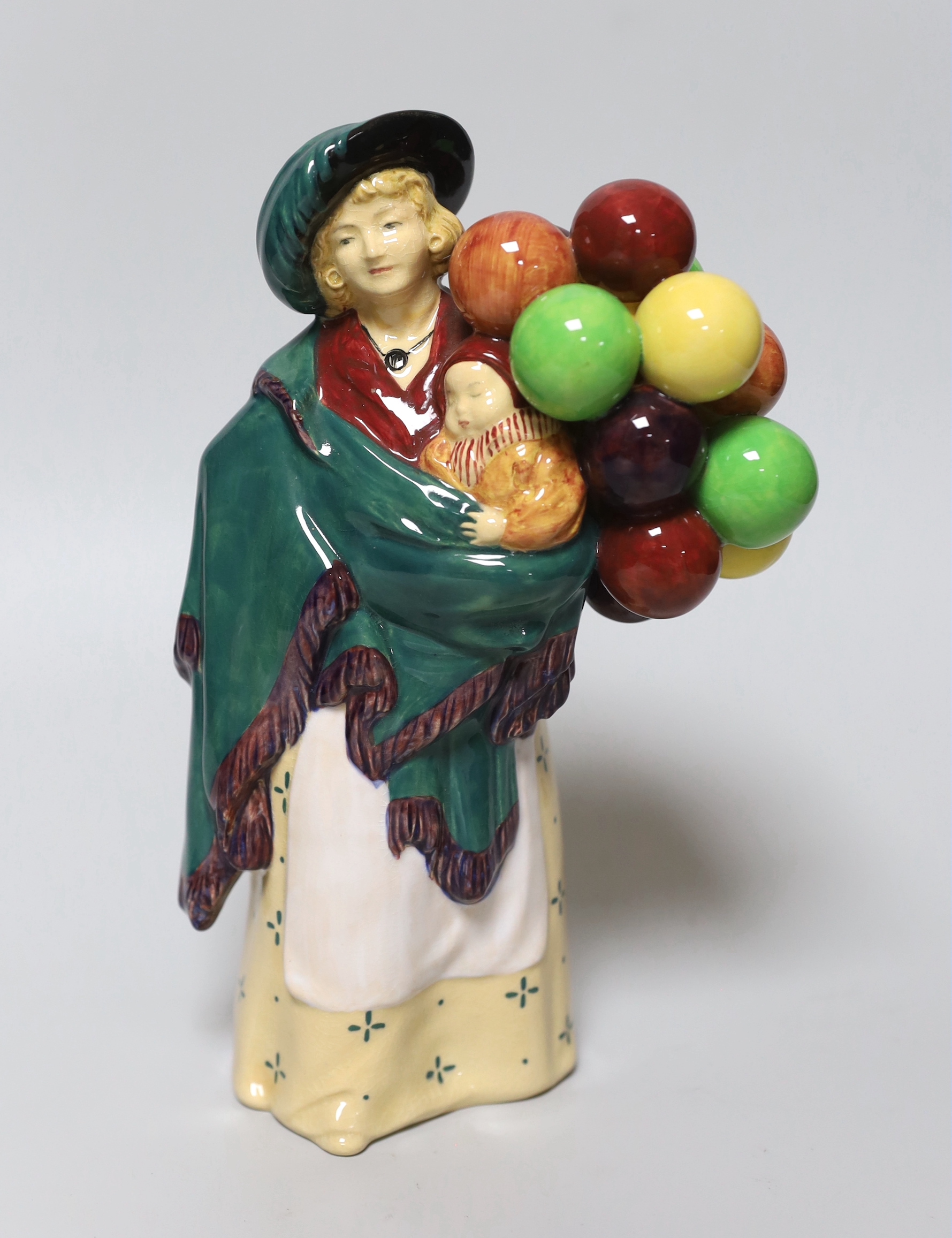 A Royal Doulton figure, 'The Balloon Seller', HN583
